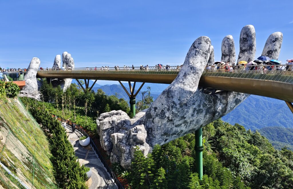 tourists at golden bridge, da nang